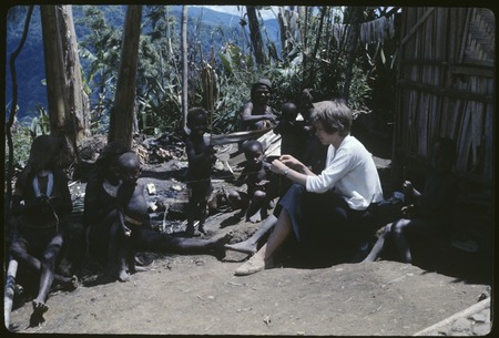 Ann Rappaport with women and children, Rappaports&#39; house on right