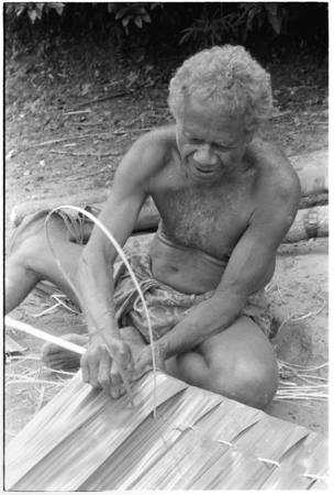 Geleniu sews palm leaf thatch panel
