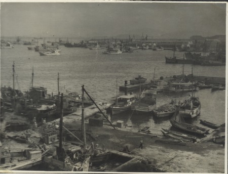 Harbor scene on Claude M. Adams visit to a Japanese fishing village and fish processing plant. Japan, c1947