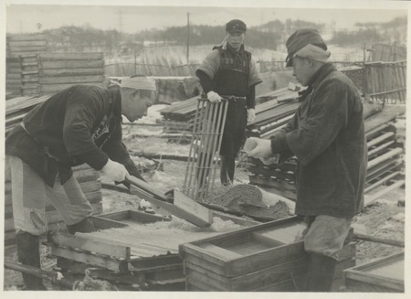 Handling agar produced from seaweed processing. Japan, c1947.