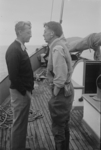 Francis Shepard and geology class design a suspended sediment trap for the  study of sand transport onto the beach. Nets were made from the toes of  wives' nylon stockings. L-r: Donald Sayner