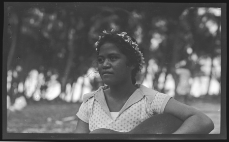 Young Cook Islands woman with guitar