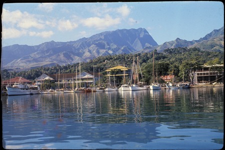 Papeete waterfront with sailboats, mountains in distance, Tahiti