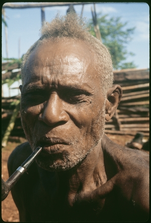 Portrait of man, smoking.