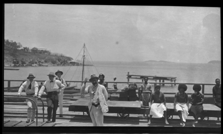 European and Papua New Guinea men on a pier