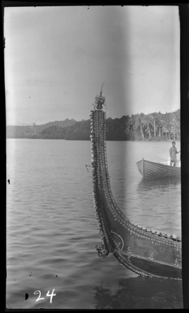 Solomon Island decorated canoe point, sculpted head close to waterline