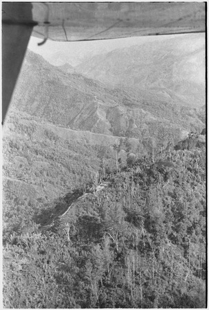 Trail and houses on mountain ridge, aerial view