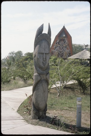 Papua New Guinea National Museum and Art Gallery: large sculpture at entrance, haus tambaran-style facade in background