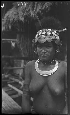 Adamase, a Motu woman of Gaile village, wearing shell head piece, and kina, crescent shell valuable necklace