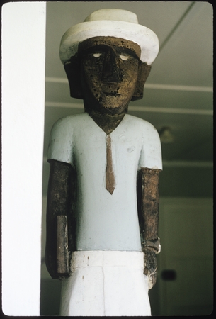 Sculpture of a man in European clothing, Makira.