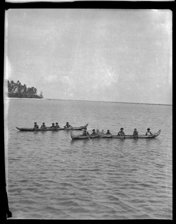 Several men on canoes