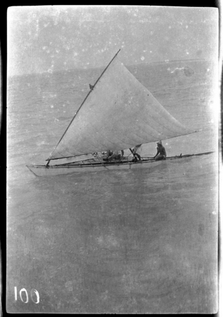 Men on Kiribati canoe with sail