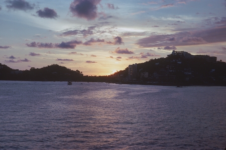 During the Swan Song Expedition (1961) a member of the ship&#39;s crew photographed this sunset as was seen from the harbor in...