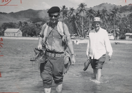 Edward L. Winterer and Edward Crisp Bullard on Vanua Lava, Vanuatu, wading to and from the boats. Nova Expedition, July 1967