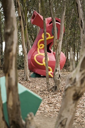 Red Shoe: side view among trees with gem in foreground