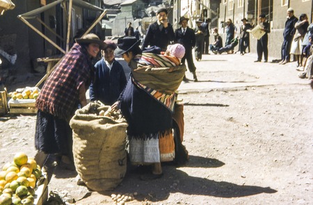 Indigenous women and children at market