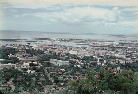 A panoramic view of Honolulu, Hawaii, and its harbor from a nearby hill top. This photo was taken by a member of the scien...