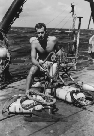 Willard N. Bascom inspects Aqualung on deck of R/V Spencer Baird