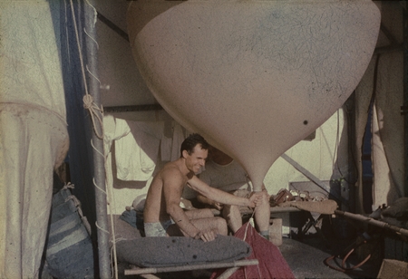 An unidentified meteorologists during the MidPac Expedition (1950), shown here with a large weather balloon at the Bikini ...