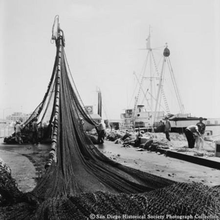 Crane hoisting fishing nets on Embarcadero