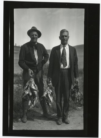Ed Fletcher and unidentified companion, with birds after the hunt