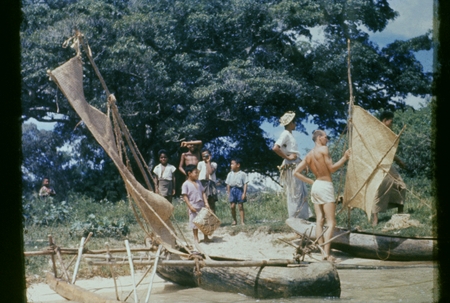[Group with outrigger canoe]