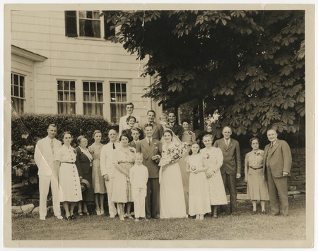 Wedding portrait of Peggy Fletcher and Paul Pierson with family members