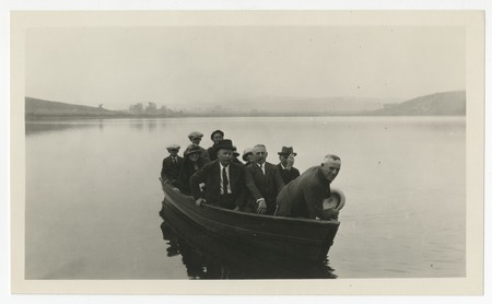 Ed Fletcher and others in a boat