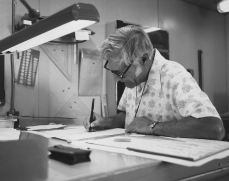 Petroleum geologist Henk Wories from the Union Oil Company, Los Angeles, California, plotting a graph in the drafting room...