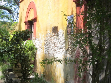 Side of house with deterioration and political propaganda
