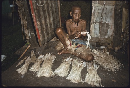 Weaving: Bomtavau plaits banana leaf fibers for a skirt