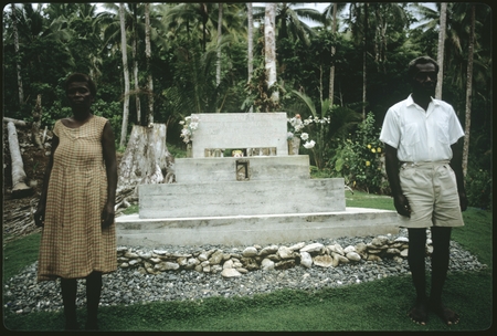 Woman and man in front of a chief memorial