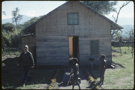 Balim Valley, Dani children and Susan Pflanz-Cook outside of Larry Naylor&#39;s house