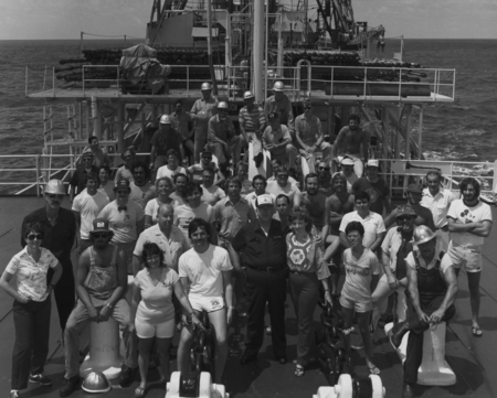 Entire crew on the foredeck of the D/V Glomar Challenger (ship) during one of the Legs of the Deep Sea Drilling Project. 1...