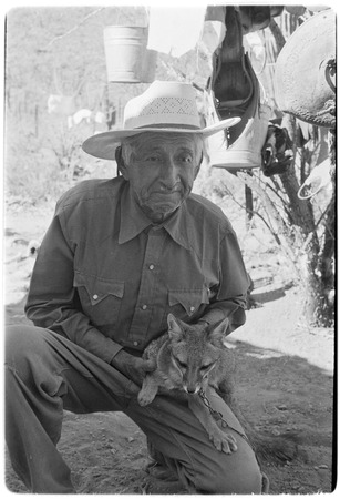 Miguel Arce Aguilar from Rancho Gregorito with pet coyote