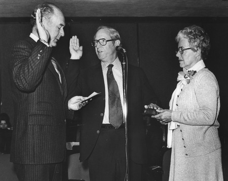 Henry W. Menard taking the oath of office as Director of the U.S. Geological Survey, with Cecil D. Andrus (left) and Giffo...