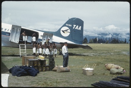 Goroka, Edwin Cook&#39;s supplies being loaded into an airplane