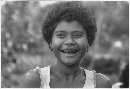 Smiling young woman, her teeth stained from betel nut