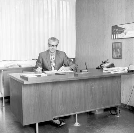 Willis Bergeson at desk, Purchasing Department, UC San Diego