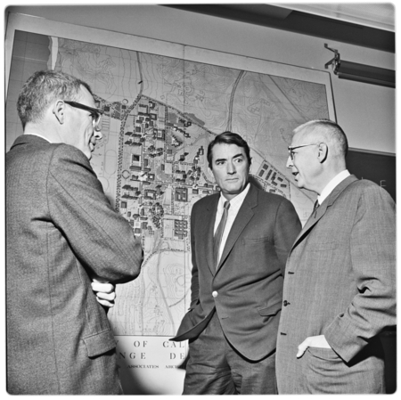 John Muir College Provost John Stewart, actor Gregory Peck, and Robert Biron) discuss site of new theatre on campus