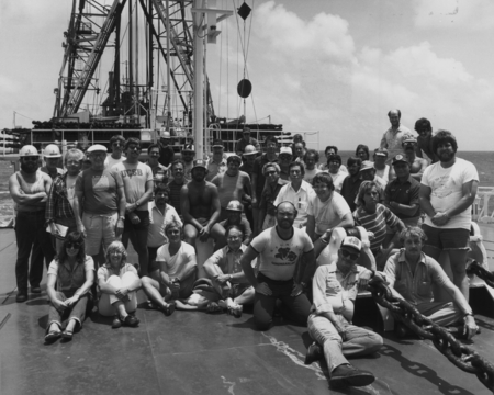 Entire crew on the foredeck of the D/V Glomar Challenger (ship) during Leg 91 of the Deep Sea Drilling Project. 1983.
