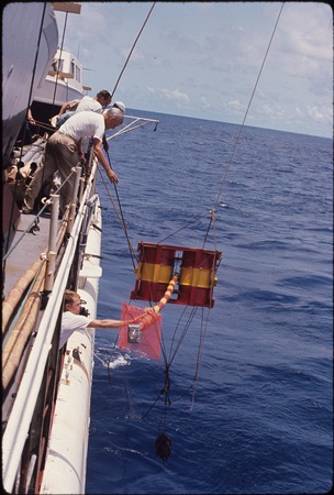 Retrieving an instrument buoy, aboard the USC&amp;GS Pioneer during the International Indian Ocean Expedition. 1964