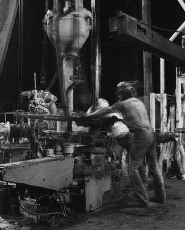 Crew members operating the drilling machines on the rig floor of the D/V Glomar Challenger (ship) during the night for the...