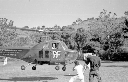 Actor Errol Flynn shown here arriving by helicopter at Scripps Institution of Oceanography. 1948.