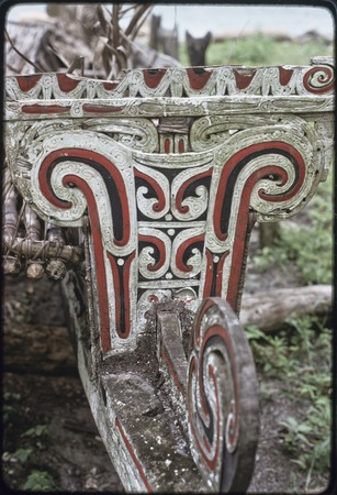 Canoes: elaborate carved and painted branch-end style prowboard and splashboard on a kula canoe