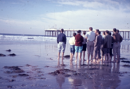 Geology class (Ocean 111) on the beach near the campus of Scripps Institution of Oceanography measuring wave heights. The ...