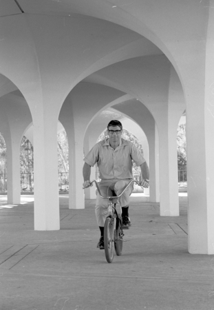 Paul D. Saltman riding bicycle, Revelle College, UC San Diego