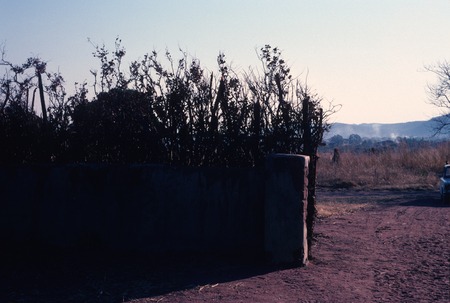 View from inside entrance gate to Chief Bwile&#39;s compound/palace, looking out towards the Democratic Republic of the Congo