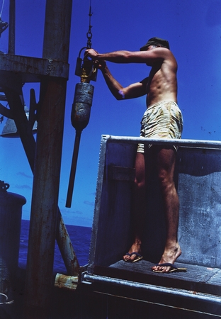 Dill #15 [Man in bucket on R/V HORIZON with Phleager coring device]