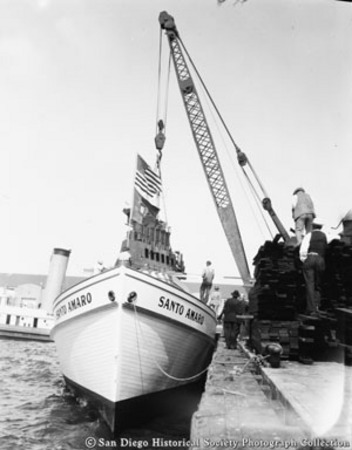 Hoisting engine above docked tuna boat Santo Amaro